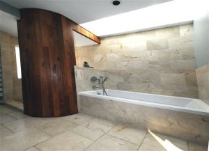 An open shower and skylights add to lime stone's appeal