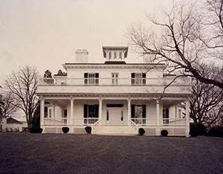 Restored white Federal-style Virginia farmhouse